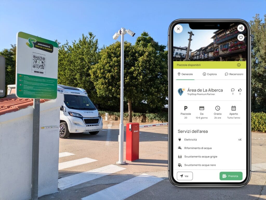 Un’area-di-sosta-per-camper-con-segnaletica-informativa-e-un’applicazione-mobile-aperta-su-uno-smartphone-che-mostra-i-servizi-disponibili-dell’“Área-de-La-Alberca”.